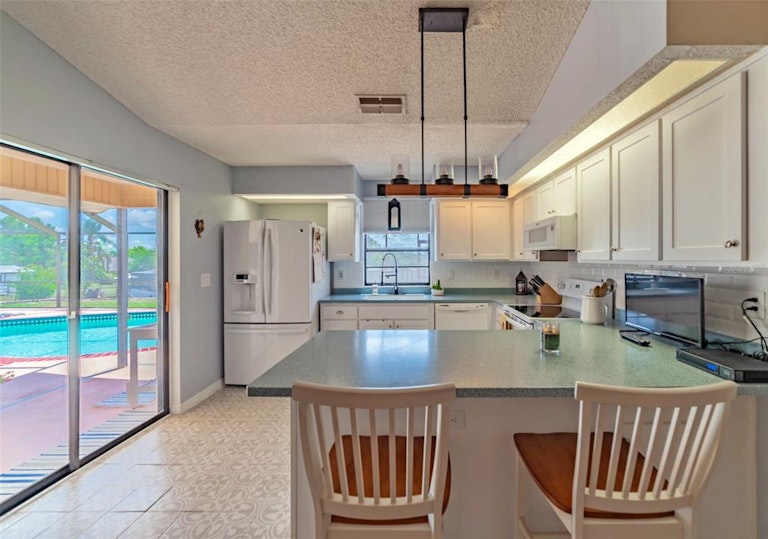 Photo 10 of 58 - 7704 Tessa Dr, Zephyrhills, FL 33540