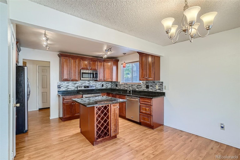 Photo 11 of 28 - 12211 Niagara Ct, Brighton, CO 80602