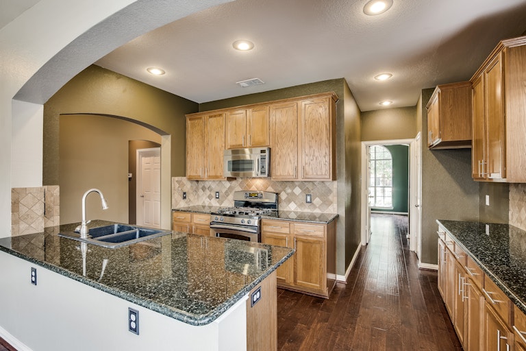 Photo 12 of 31 - 2441 Deerwood Dr, Little Elm, TX 75068