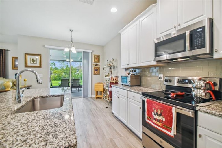 Photo 6 of 72 - 18123 Cortes Creek Blvd, Spring Hill, FL 34610
