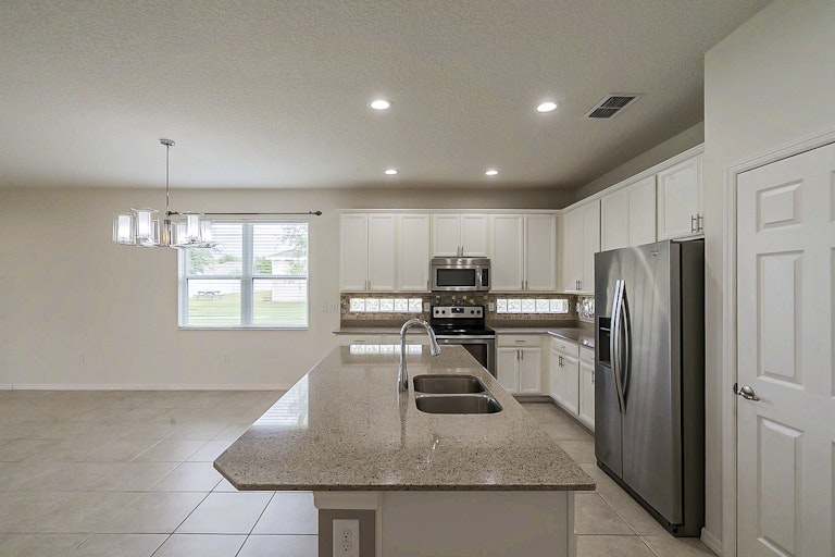 Photo 8 of 29 - 3343 Bethpage Loop, Mount Dora, FL 32757