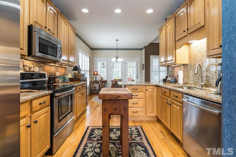Photo 9 of 40 - 1027 Loch Lomond Dr, Clayton, NC 27520
