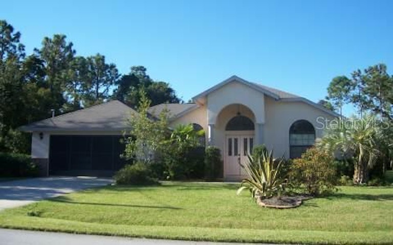Photo 1 of 4 - 65 Burbank Dr, Palm Coast, FL 32137