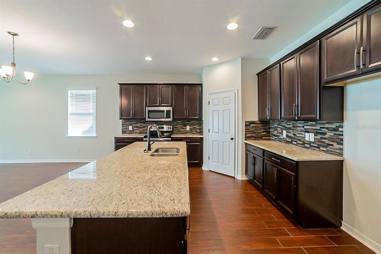Photo 6 of 24 - 32601 Harmony Oaks Dr, Wesley Chapel, FL 33545