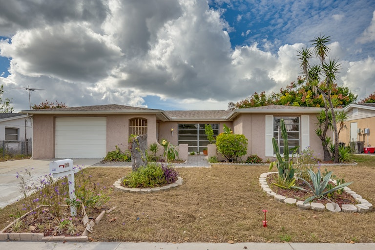 Photo 1 of 14 - 9605 Rainbow Ln, Port Richey, FL 34668
