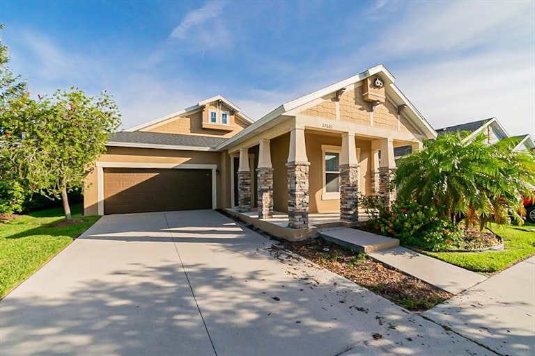 Photo 1 of 24 - 32601 Harmony Oaks Dr, Wesley Chapel, FL 33545