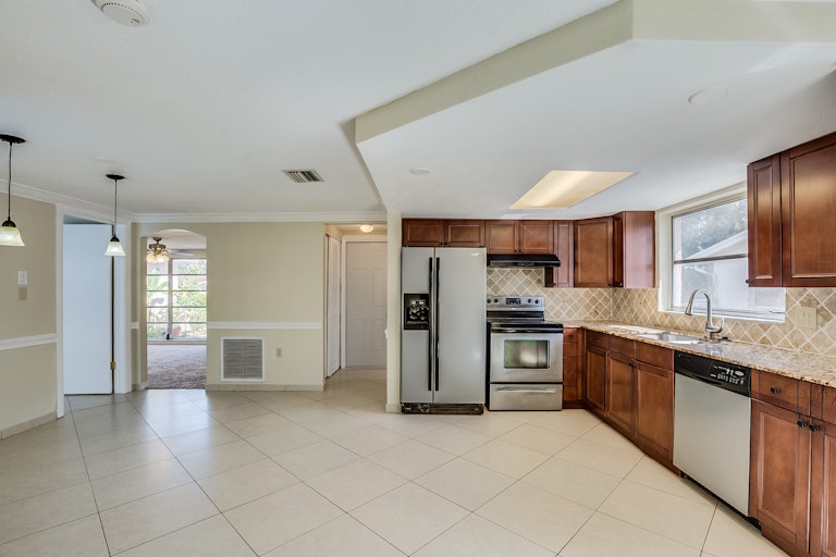 Photo 4 of 14 - 9605 Rainbow Ln, Port Richey, FL 34668