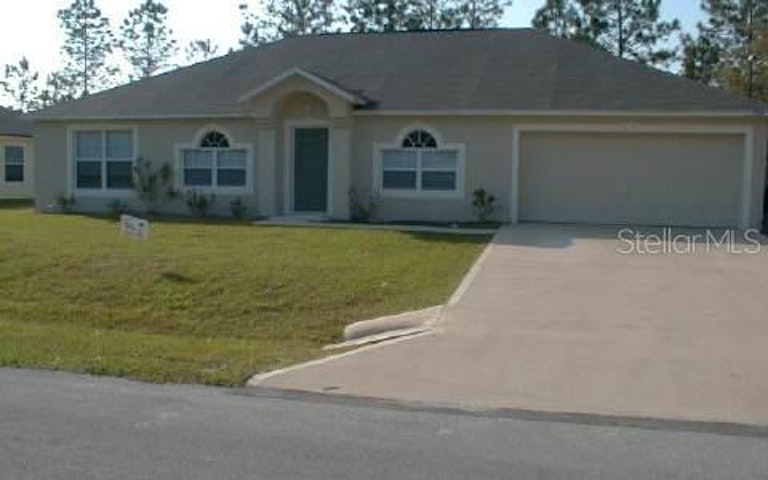 Photo 1 of 4 - 128 Persimmon Dr, Palm Coast, FL 32164