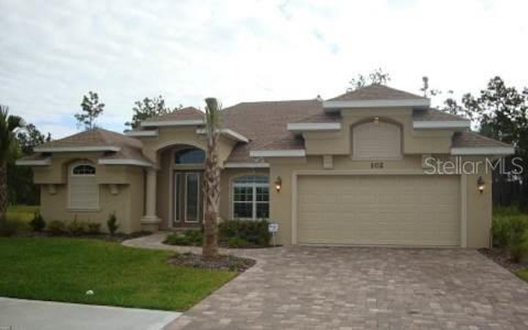 Photo 1 of 24 - 102 S Coopers Hawk Way, Palm Coast, FL 32164