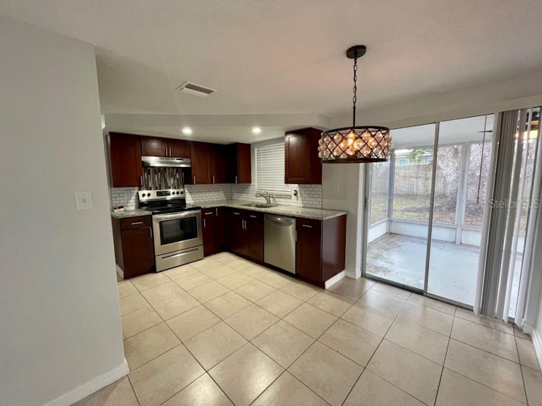 Photo 8 of 24 - 9020 Rainbow Ln, Port Richey, FL 34668