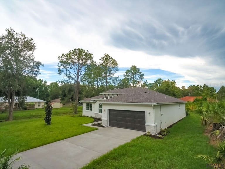 Photo 3 of 10 - 23 Rockingham Ln, Palm Coast, FL 32164