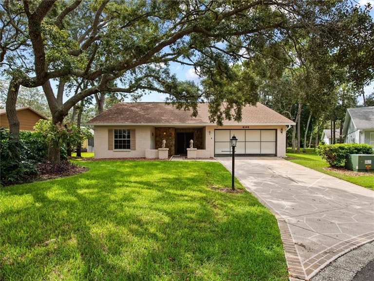 Photo 1 of 65 - 6144 Muirfield Ct, Spring Hill, FL 34606