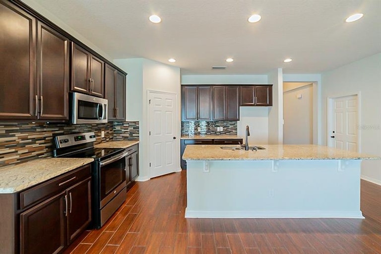 Photo 7 of 24 - 32601 Harmony Oaks Dr, Wesley Chapel, FL 33545