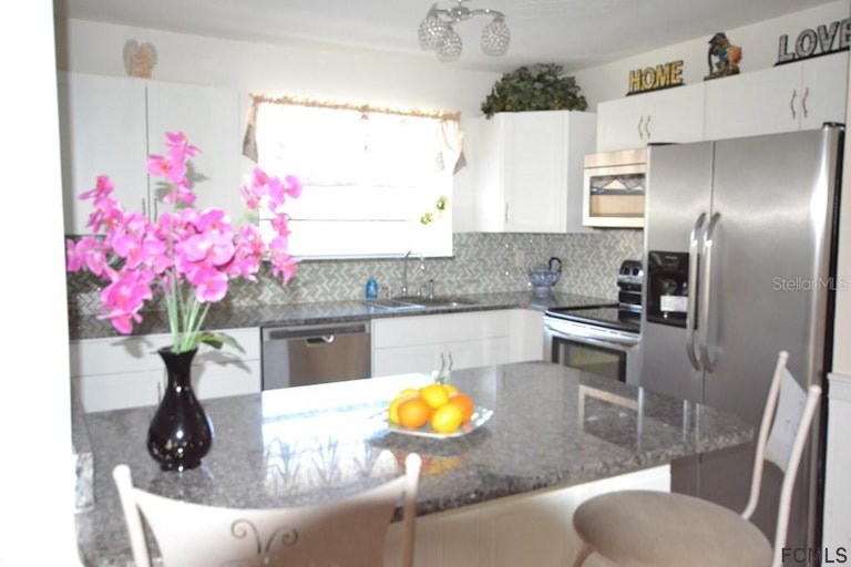 Photo 3 of 22 - 59 Farragut Dr, Palm Coast, FL 32137