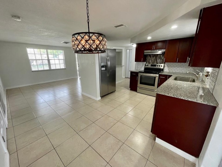 Photo 10 of 24 - 9020 Rainbow Ln, Port Richey, FL 34668